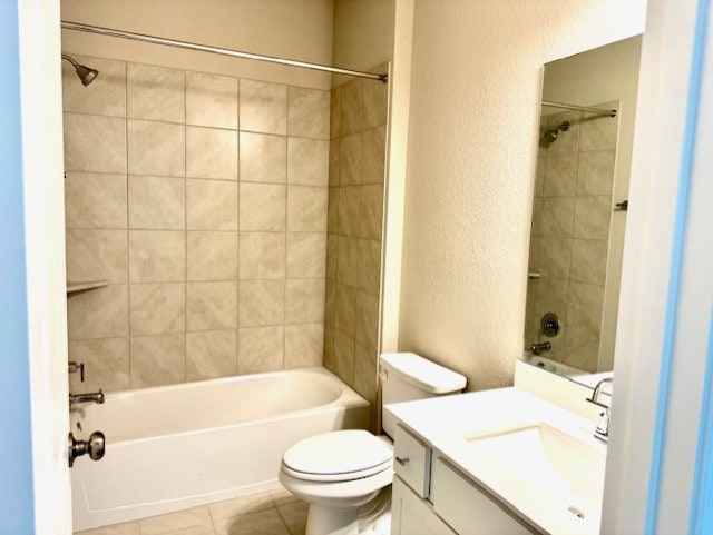 328 Milkwood Ter, Dripping Springs, TX 78620 - bathroom with a textured wall, bathing tub / shower combination, toilet, vanity, and tile patterned floors