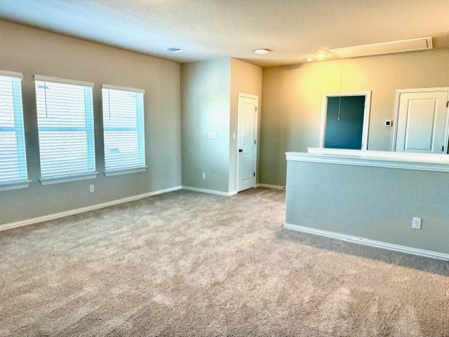 328 Milkwood Ter, Dripping Springs, TX 78620 - unfurnished room featuring carpet, attic access, and baseboards
