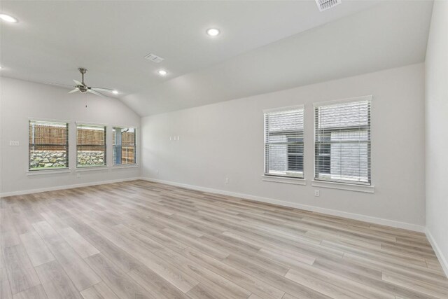 200 Hidalgo Ln, Elgin, TX 78621 - empty room with a ceiling fan, recessed lighting, vaulted ceiling, baseboards, and light wood-style flooring