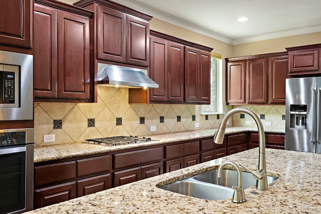 1720 Foxboro Ln, Cedar Park, TX 78613 - kitchen featuring stainless steel appliances, a sink, under cabinet range hood, backsplash, and light stone counters