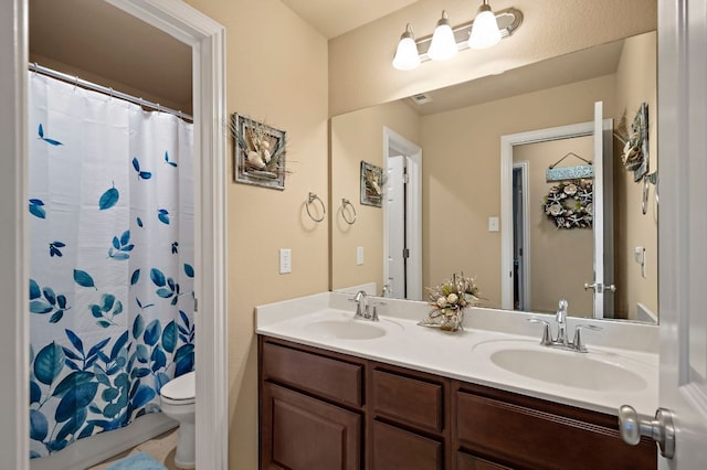 1720 Foxboro Ln, Cedar Park, TX 78613 - bathroom featuring double vanity, toilet, and a shower with curtain