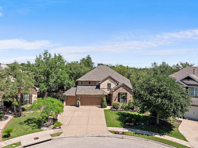 1720 Foxboro Ln, Cedar Park, TX 78613 - french country style house with concrete driveway, stone siding, and a garage
