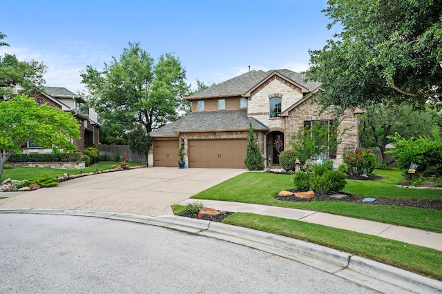 1720 Foxboro Ln, Cedar Park, TX 78613 - view of front of home featuring driveway, stone siding, and an attached garage