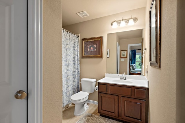 1720 Foxboro Ln, Cedar Park, TX 78613 - bathroom with toilet, vanity, and curtained shower