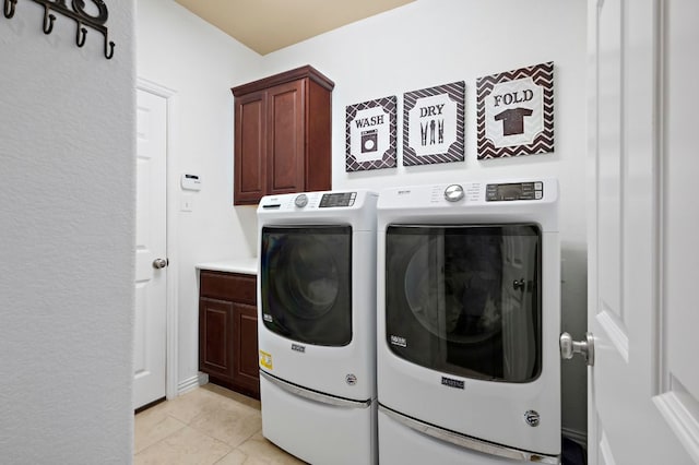 1720 Foxboro Ln, Cedar Park, TX 78613 - laundry room with washer and clothes dryer, cabinet space, and light tile patterned floors