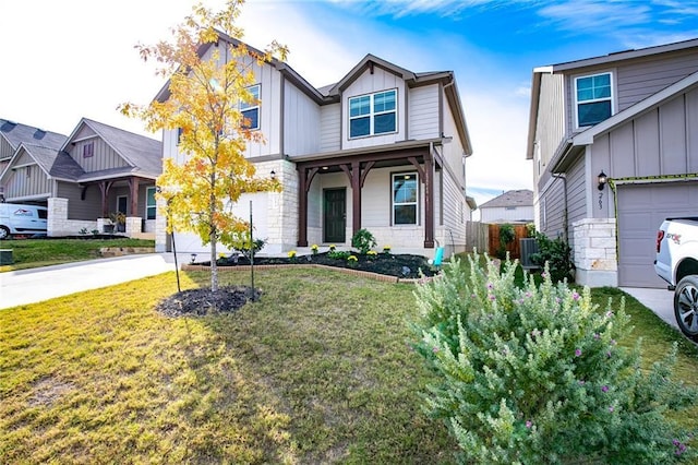 253 Beechnut Dr, Buda, TX 78610 - craftsman house with board and batten siding, concrete driveway, a front lawn, and a garage