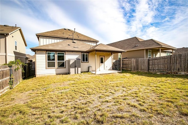 253 Beechnut Dr, Buda, TX 78610 - back of house featuring a patio and a shingled roof