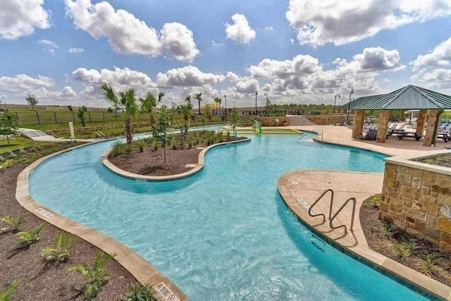 253 Beechnut Dr, Buda, TX 78610 - community pool with a gazebo, a patio area, and fence