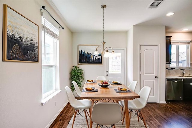 253 Beechnut Dr, Buda, TX 78610 - dining space with a chandelier, dark wood finished floors, baseboards, and recessed lighting