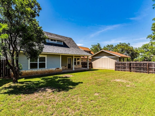 rear view of property with roof with shingles