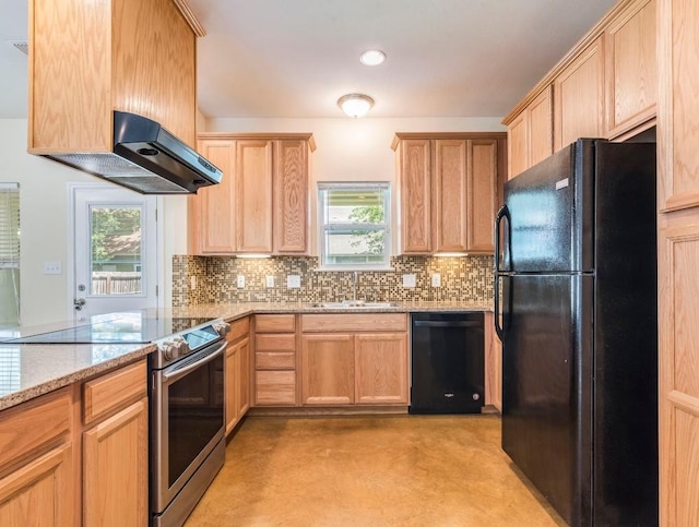 kitchen featuring black appliances, light brown cabinets, a sink, plenty of natural light, and recessed lighting