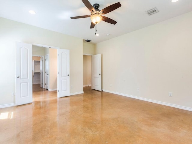 spare room featuring a ceiling fan, baseboards, recessed lighting, and finished concrete floors