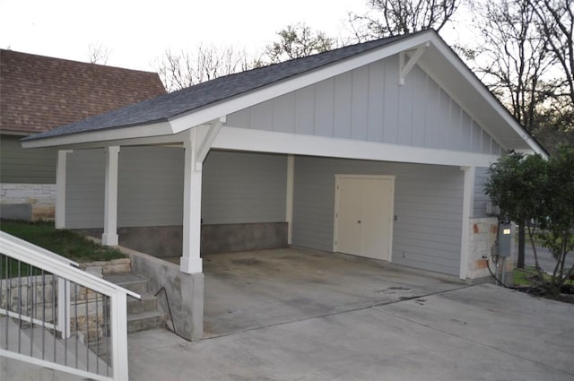 garage featuring concrete driveway