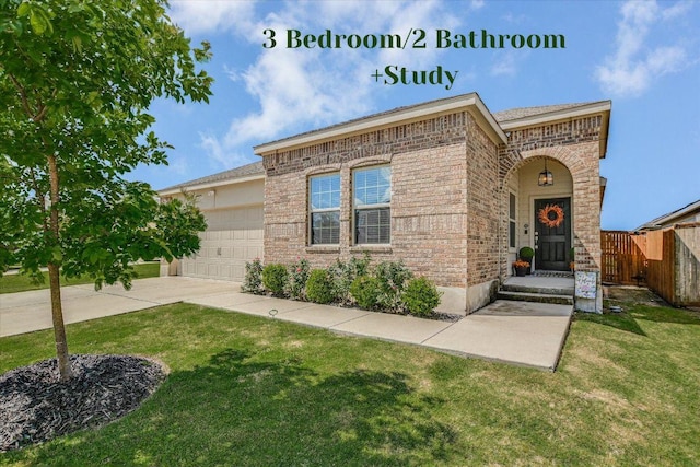 216 Xanadu Dr, Jarrell, TX 76537 - view of front of house with brick siding, a garage, and concrete driveway
