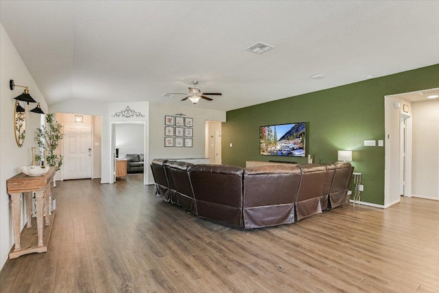 216 Xanadu Dr, Jarrell, TX 76537 - living area featuring wood finished floors, ceiling fan, lofted ceiling, and baseboards