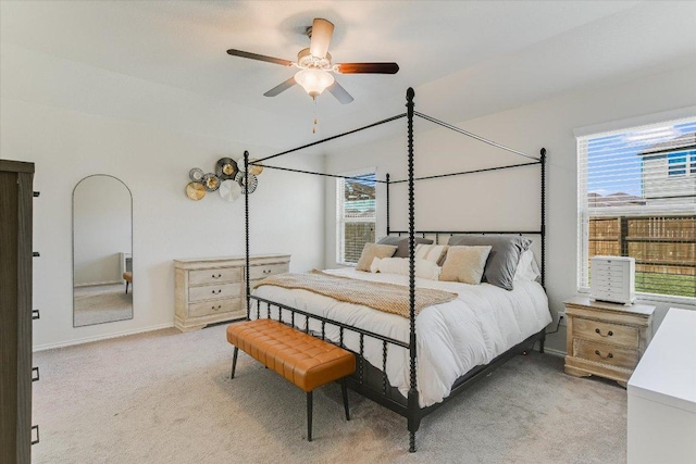 216 Xanadu Dr, Jarrell, TX 76537 - bedroom featuring multiple windows, light carpet, and a ceiling fan