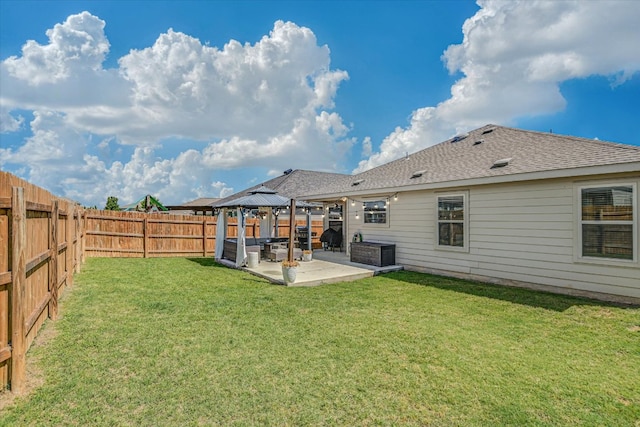 216 Xanadu Dr, Jarrell, TX 76537 - back of property with a gazebo, a patio area, and a shingled roof