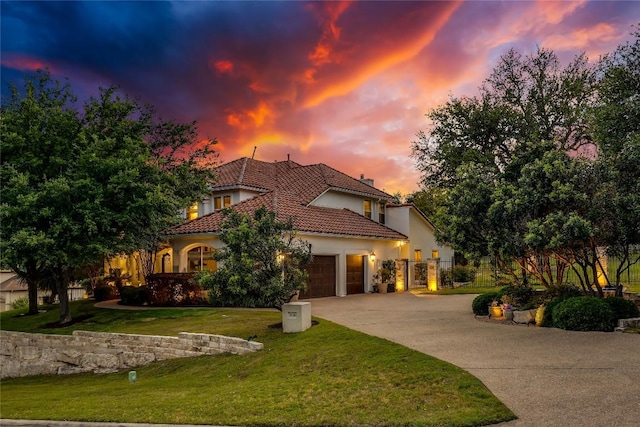 2116 Demona Dr, Austin, TX 78733 - mediterranean / spanish-style house featuring a garage, driveway, stucco siding, and a tile roof