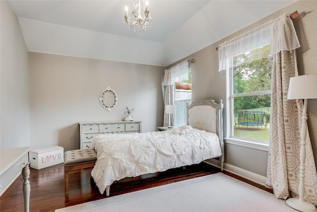 2116 Demona Dr, Austin, TX 78733 - bedroom featuring wood finished floors, baseboards, a chandelier, and vaulted ceiling