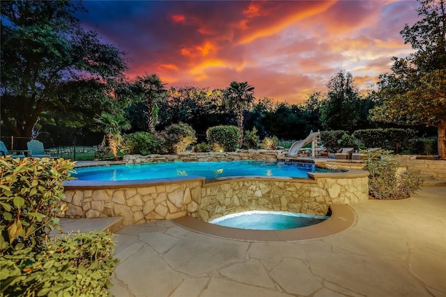 2116 Demona Dr, Austin, TX 78733 - view of swimming pool featuring a water slide and a patio
