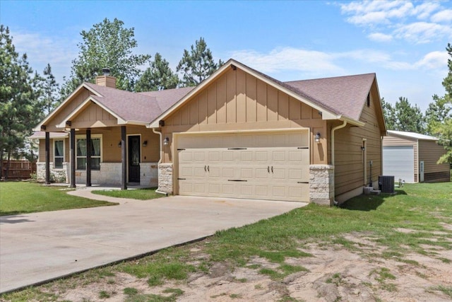 113 N Buckhorn Dr, Bastrop, TX 78602 - view of front of home with an attached garage, stone siding, a chimney, and driveway