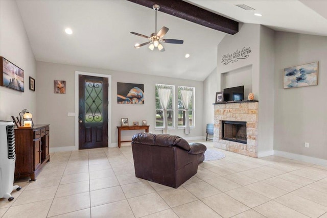 113 N Buckhorn Dr, Bastrop, TX 78602 - living room with ceiling fan, light tile patterned floors, beamed ceiling, a fireplace, and baseboards