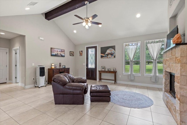 113 N Buckhorn Dr, Bastrop, TX 78602 - living area featuring light tile patterned floors, a ceiling fan, beamed ceiling, high vaulted ceiling, and a stone fireplace