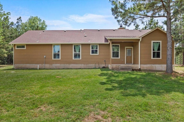113 N Buckhorn Dr, Bastrop, TX 78602 - back of house featuring a yard