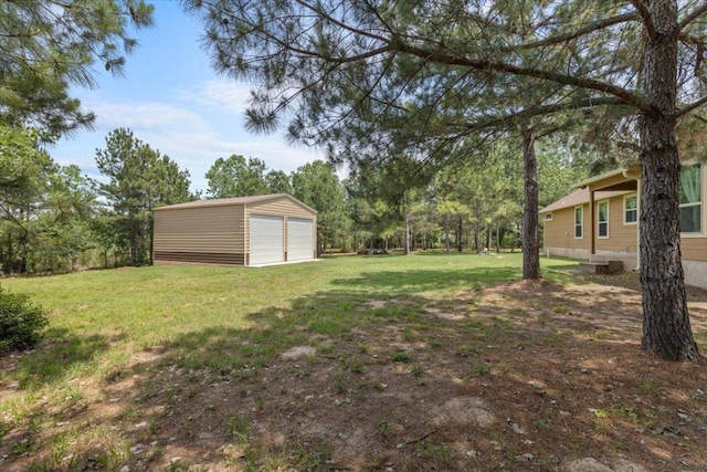 113 N Buckhorn Dr, Bastrop, TX 78602 - view of green lawn featuring a garage and an outbuilding