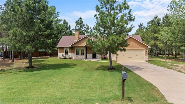 113 N Buckhorn Dr, Bastrop, TX 78602 - view of front of home with stone siding, driveway, a chimney, and a garage