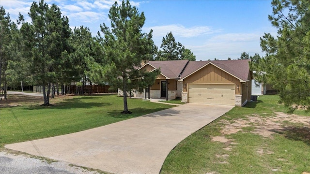113 N Buckhorn Dr, Bastrop, TX 78602 - view of front of house with concrete driveway, an attached garage, board and batten siding, and stone siding