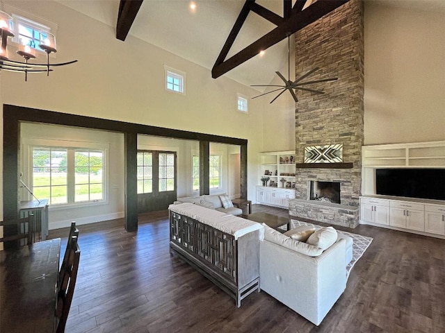 1402 Countryside Bnd, Fredericksburg, TX 78624 - living area featuring high vaulted ceiling, beamed ceiling, healthy amount of natural light, dark wood-type flooring, and a ceiling fan