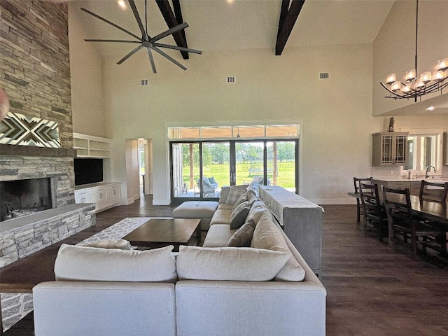 1402 Countryside Bnd, Fredericksburg, TX 78624 - living area with high vaulted ceiling, baseboards, a chandelier, dark wood-style flooring, and beamed ceiling