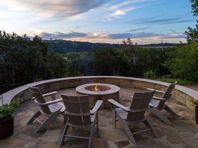 13708 Montview Dr, Austin, TX 78732 - patio terrace at dusk featuring a fire pit