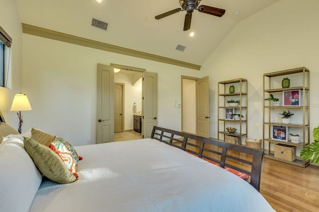 13708 Montview Dr, Austin, TX 78732 - bedroom with lofted ceiling, crown molding, recessed lighting, connected bathroom, and light wood-type flooring