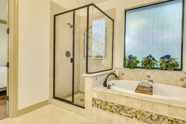 13708 Montview Dr, Austin, TX 78732 - bathroom featuring a stall shower, tile patterned floors, a garden tub, and ensuite bathroom