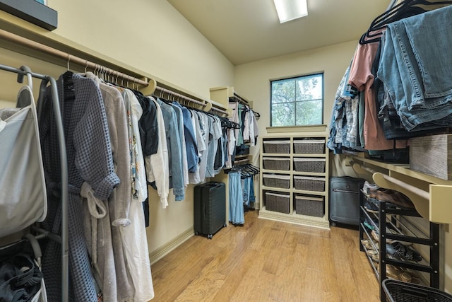 13708 Montview Dr, Austin, TX 78732 - spacious closet featuring light wood-type flooring and lofted ceiling
