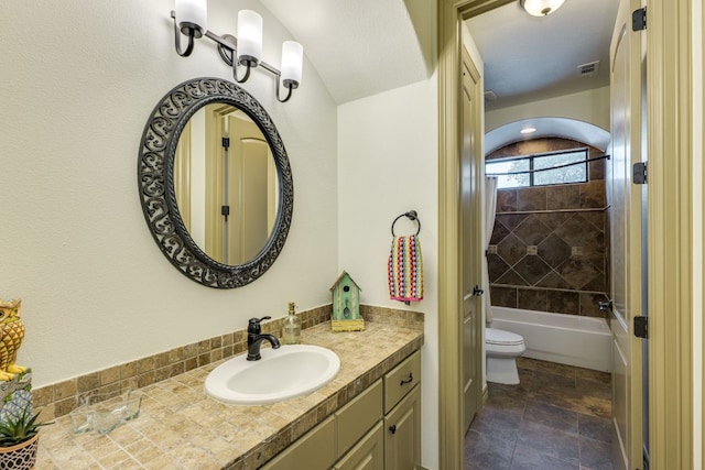 13708 Montview Dr, Austin, TX 78732 - full bath featuring vanity, toilet, shower / bath combination, and stone finish flooring