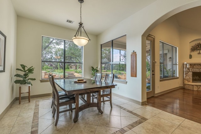 13708 Montview Dr, Austin, TX 78732 - dining space featuring plenty of natural light, inlaid floor details, and arched walkways