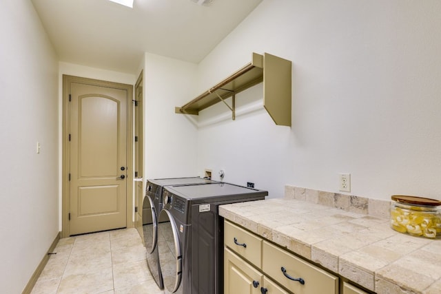 13708 Montview Dr, Austin, TX 78732 - laundry room featuring washer and dryer, cabinet space, baseboards, and light tile patterned floors