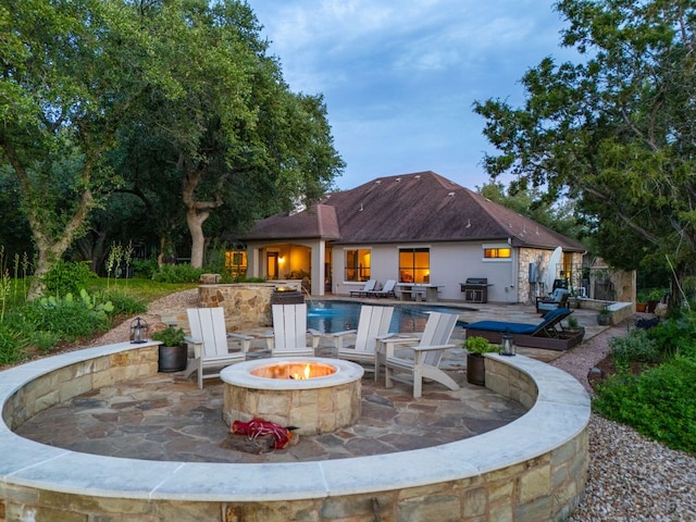 13708 Montview Dr, Austin, TX 78732 - view of patio / terrace with an outdoor fire pit