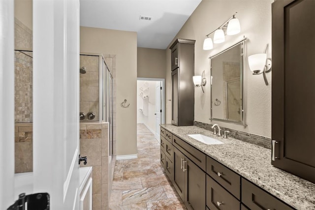 1044 Highknoll Ln, Georgetown, TX 78628 - full bathroom with a shower stall, vanity, and baseboards