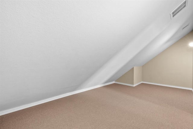 1044 Highknoll Ln, Georgetown, TX 78628 - bonus room featuring carpet, vaulted ceiling, and baseboards