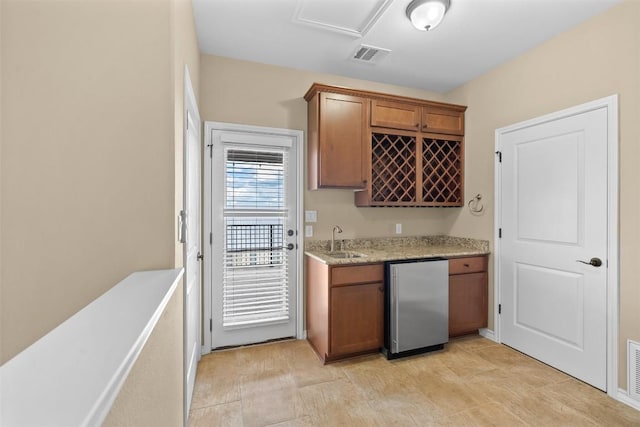 1044 Highknoll Ln, Georgetown, TX 78628 - indoor wet bar featuring freestanding refrigerator