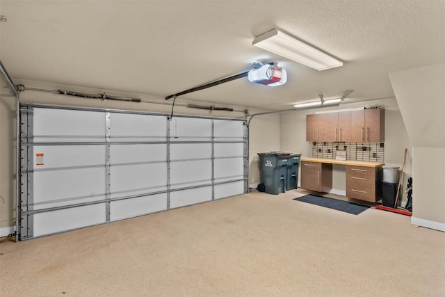 1044 Highknoll Ln, Georgetown, TX 78628 - garage featuring a garage door opener and baseboards