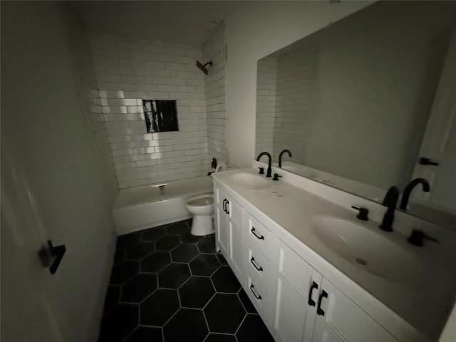 full bathroom with toilet, tile patterned flooring, double vanity, and shower / tub combination