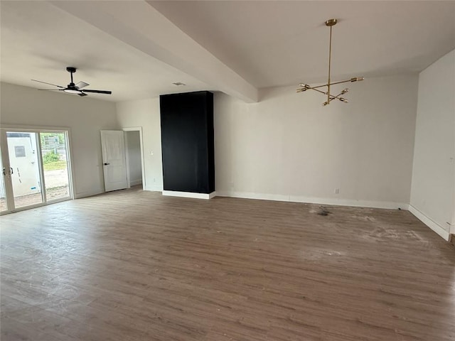 empty room with wood finished floors, baseboards, a chandelier, and ceiling fan