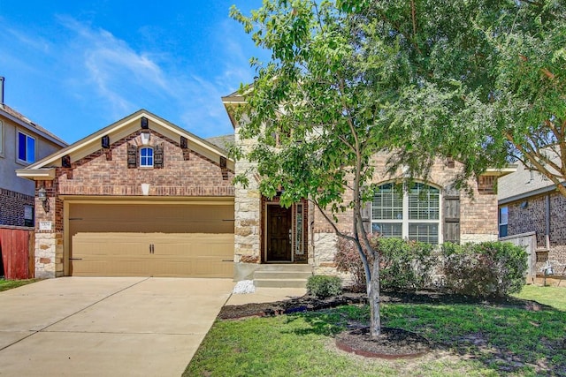 view of front of home featuring brick siding, an attached garage, and driveway