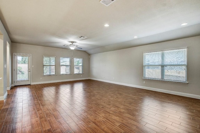 spare room featuring baseboards, a ceiling fan, dark wood-type flooring, recessed lighting, and lofted ceiling