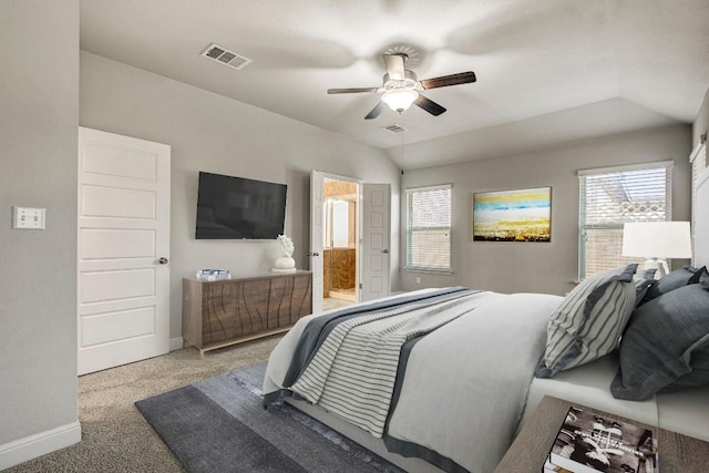 carpeted bedroom with baseboards, a ceiling fan, and ensuite bathroom
